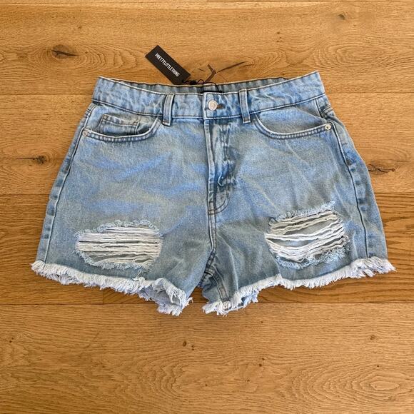PrettyLittleThing - Tall Mid Rise Distressed Denim Shorts in Light Blue Wash - Picture 1 of 4